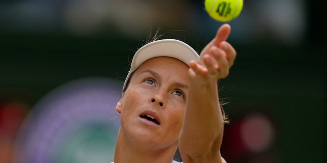 Tatjana Maria serves to Ons Jabeur in a women's singles semifinal match at Wimbledon, Thursday, July 7, 2022.