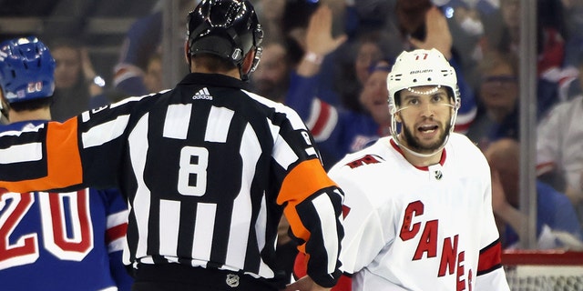 Tony DeAngelo of the Carolina Hurricanes argues a call with referee Francois St. Laurent in Game 6 of the second round of the 2022 Stanley Cup playoffs against the Rangers at Madison Square Garden May 28, 2022, in New York City. 