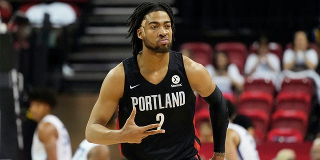 Portland Trail Blazers' Trendon Watford celebrates after making a 3-point shot against the New York Knicks during the first half an NBA summer league championship basketball game Sunday, July 17, 2022, in Las Vegas. 