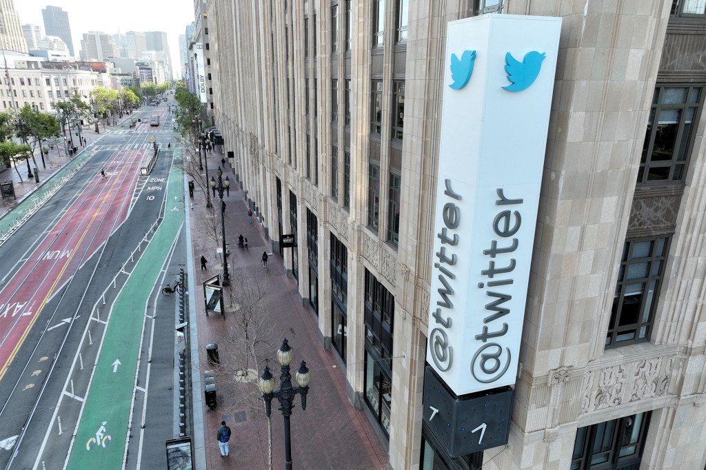 In an aerial view, a sign is seen posted on the exterior of Twitter headquarters on April 27, 2022 in San Francisco, California. 