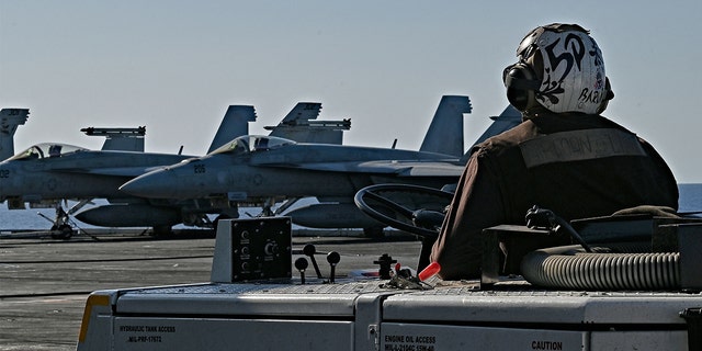 F/A-18 Hornet fighter jets are stationed on the deck of the US Nimitz-class nuclear-powered aircraft carrier USS Harry S. Truman, during a NATO vigilance activity NEPTUNE SHIELD 2022 (NESH22) on eastern Mediterranean Sea on May 23, 2022.