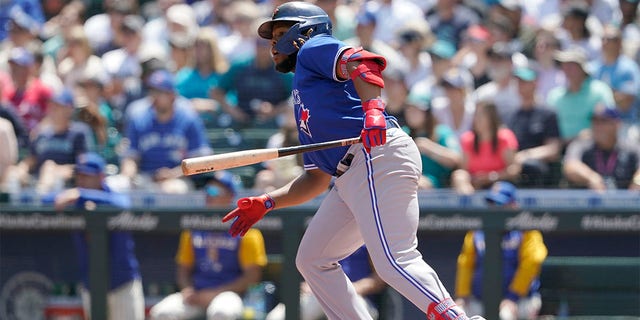 Toronto Blue Jays' Vladimir Guerrero Jr. watches after lining out to left field during the first inning of a baseball game against the Seattle Mariners, Sunday, July 10, 2022, in Seattle.