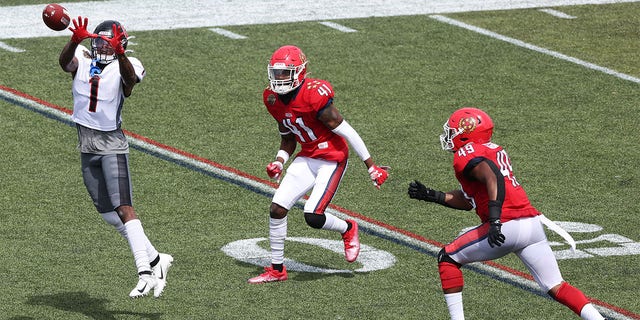 Isaiah Zuber of the Houston Gamblers jumps to catch the ball as De'Vante Bausby and Angelo Garbutt of the New Jersey Generals defend in the first quarter of the game at Protective Stadium on May 21, 2022, in Birmingham, Ala. 