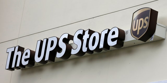 This Tuesday, Jan. 29, 2013,  photo, shows a UPS store in Hialeah, Fla.  United Parcel Service Inc. says it was slowed down in the fourth quarter  of 2012, by weak global trade and a disappointing holiday-shopping season.  (AP Photo/Alan Diaz)