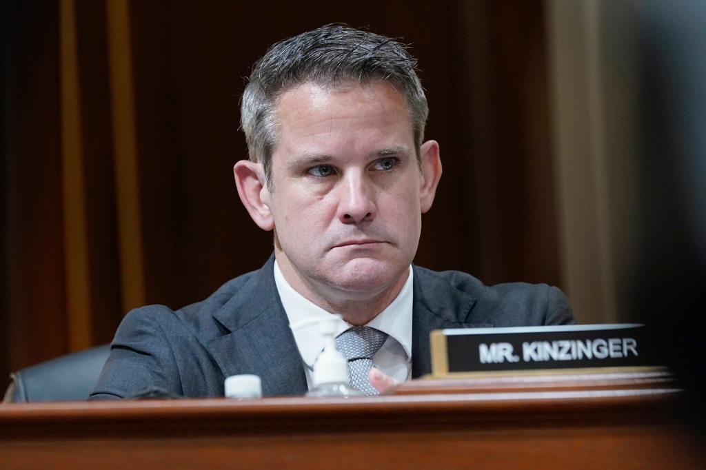 Rep. Adam Kinzinger listens as the House select committee investigating the Jan. 6 attack.