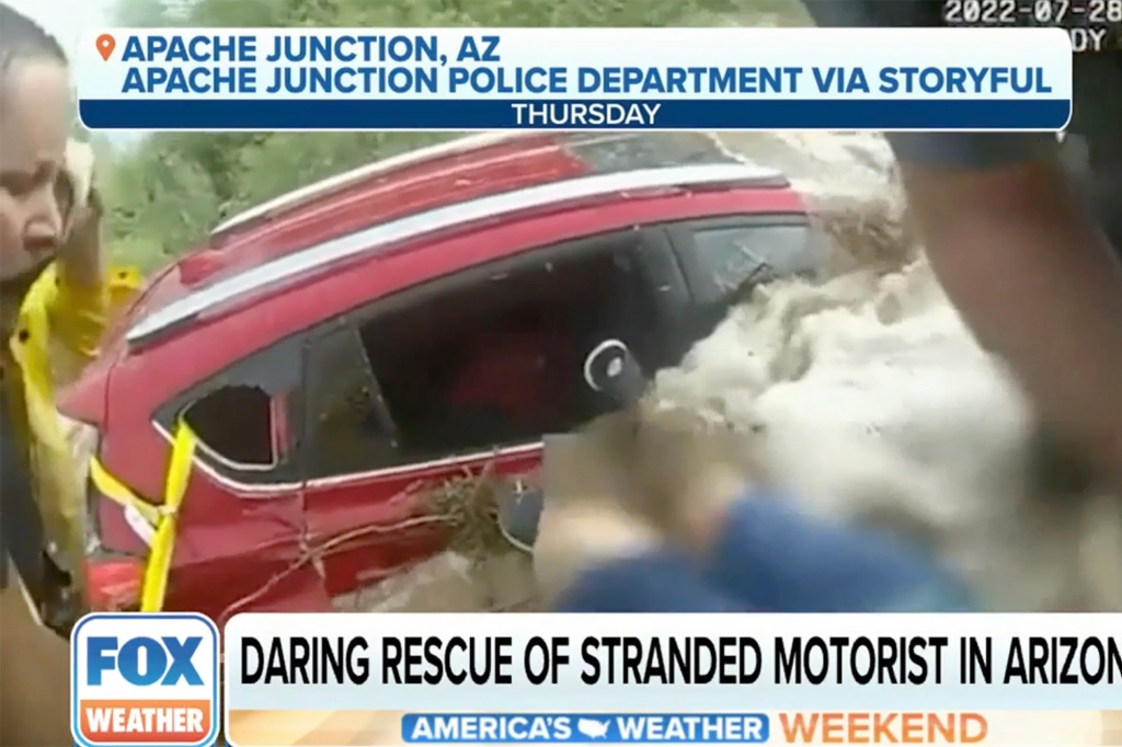 Sue Teders’ red car was quickly flooded as authorities rushed to get her out.