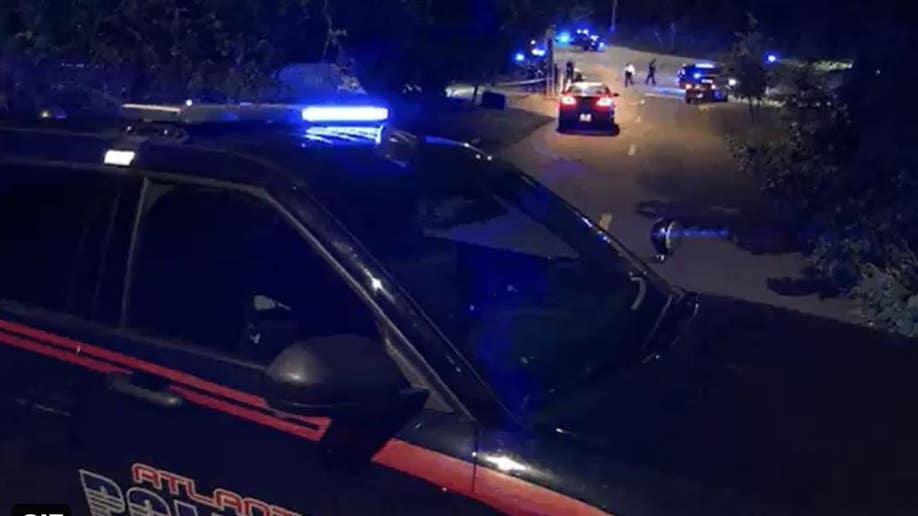 An Atlanta Police Department cruiser is pictured near the scene of a shooting