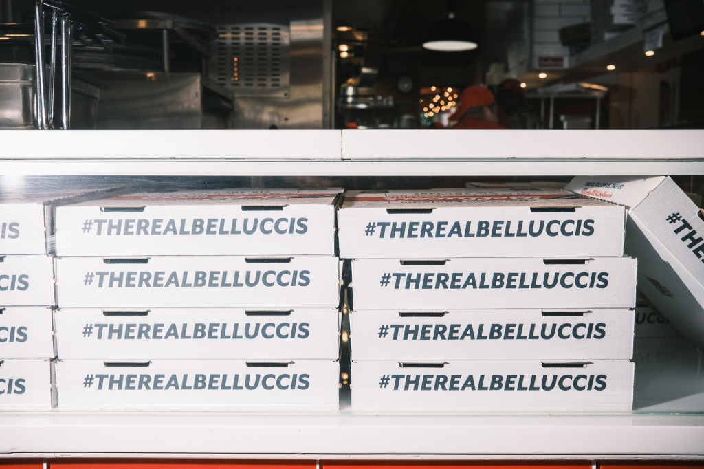 Pizza boxes at Bellucci's in Astoria read "#therealbelluccis"