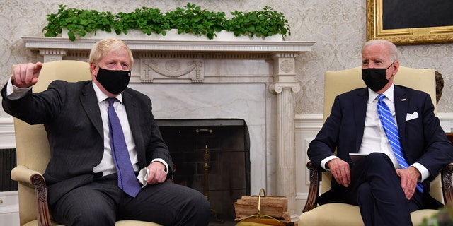 US President Joe Biden (R) holds a bilateral meeting with Britain's Prime Minister Boris Johnson at the Oval Office of the White House in Washington, DC on September 21, 2021. (Photo by Nicholas Kamm / AFP) (Photo by NICHOLAS KAMM/AFP via Getty Images) 