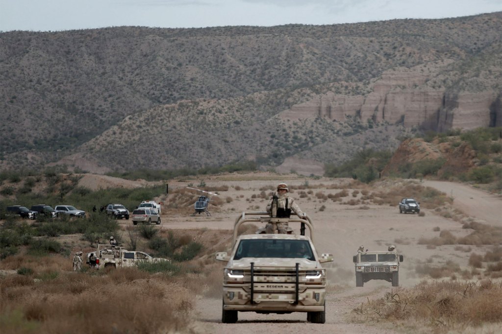 Mexican military patrol in La Mora, Sonora state, Mexico, the community where people are holding the funeral for Dawna Ray Langford, 43, and her sons Trevor, 11, and Rogan, 2, who were killed by drug cartel gunmen, on Nov. 7, 2019.