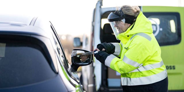 A member of staff collects a COVID-19 PCR test, at the Covid testing site of Svagertorp, Malmoe, Sweden, Tuesday, Feb. 8, 2022. Starting Wednesday, Sweden ends the wide-scale testing for COVID-19 even among people showing symptoms of coronavirus infection, a move that puts the Scandinavian nation at odds with most of Europe but could become the norm as the costs of testing yields fewer benefits as the omicron variant proves milder and governments begin to consider treating covid-19 as other endemic illnesses.