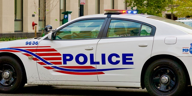 FILE- A Washington, D.C. Metropolitan Police Department police cruiser blocks a street near the White House.