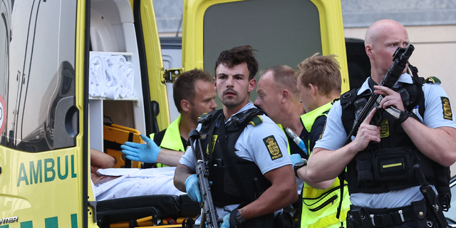 People are evacuated of the Fields shopping center in Copenhagen, Denmark, on July 3, 2022 after Danish media reported a shooting.