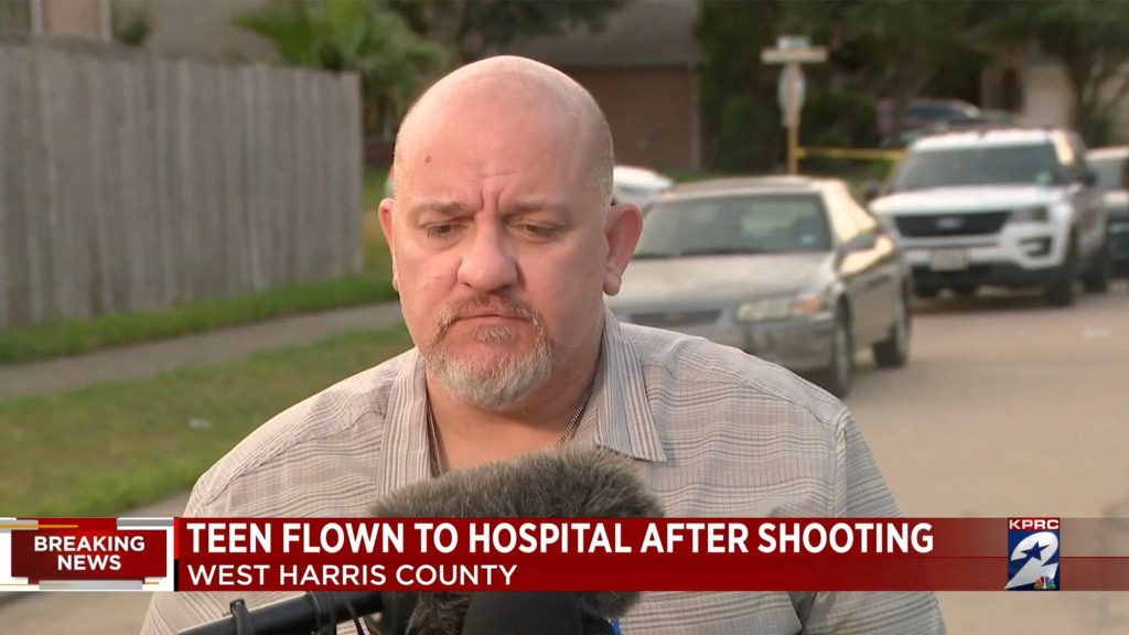 A Harris County sheriff's deputy said the teenager was shot in the thigh 31 seconds into his walk to the trash can. 