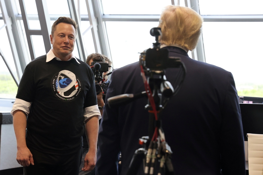 Then-President Donald Trump and Elon Musk are seen at the launch of a SpaceX Falcon 9 rocket and Crew Dragon spacecraft at NASA's Kennedy Space Center in Cape Canaveral, Florida on May 30, 2020.