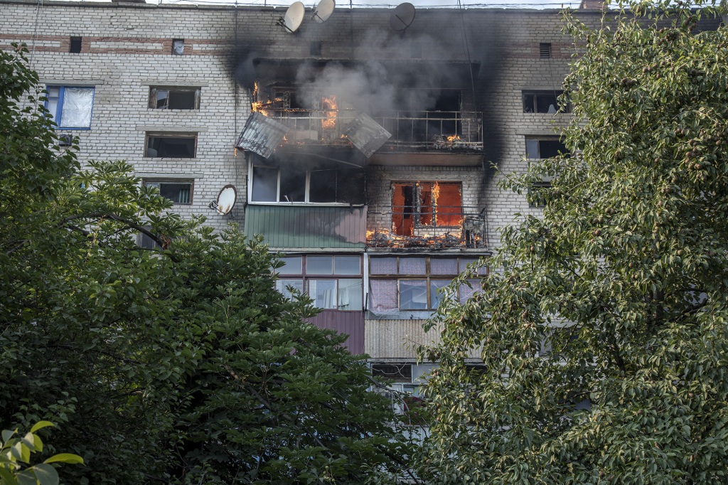 Apartments of a building burn on fire during heavy shelling in Siversk, Ukraine, July 08th, 2022.