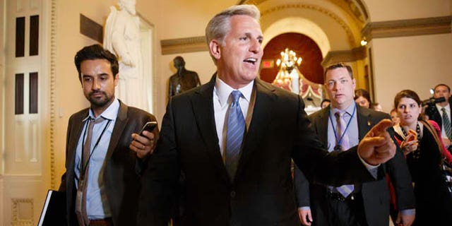 In this photo taken June 11, 2014, House Majority Whip, Republican Kevin McCarthy of Calif., leaves House Speaker John Boehner's office on Capitol Hill in Washington.  