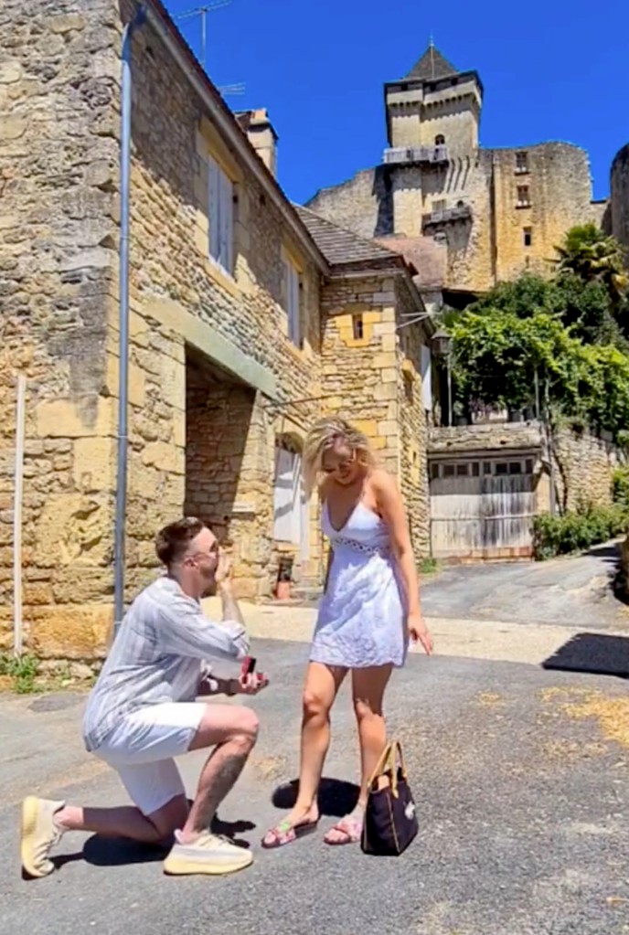 Lewis Paterson on one knee and Nicola Bolton during the proposal