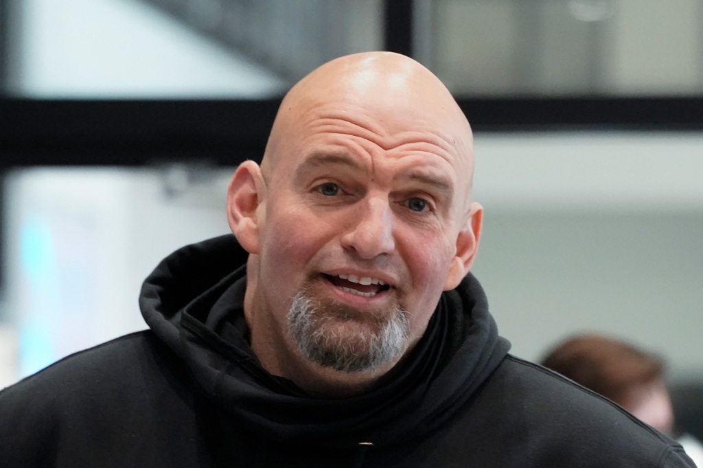 In this photo made on Friday, March 4, 2022, Pennsylvania Lt. Gov. John Fetterman visits with people attending a Democratic Party event for candidates to meet and collect signatures for ballot petitions for the upcoming Pennsylvania primary election, at the Steamfitters Technology Center in Harmony, Pa. Fetterman is running for the party nomination for the U.S. Senate