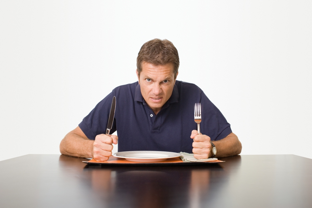 Angry man waiting for meal