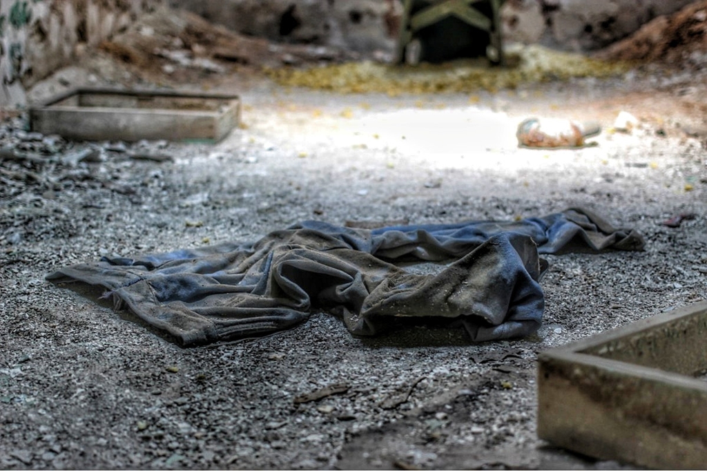 Old pieces of fabric on the floor of prison