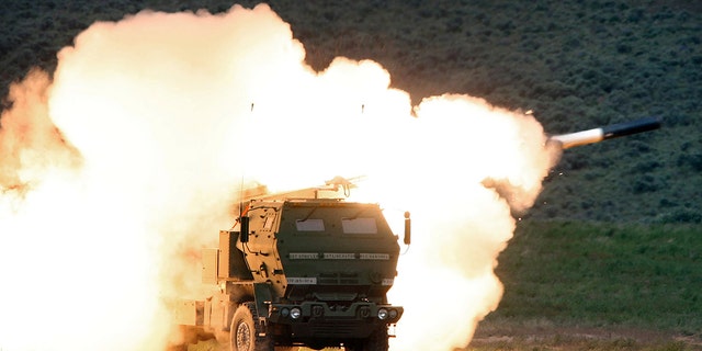 A launch truck fires the High Mobility Artillery Rocket System (HIMARS) produced by Lockheed Martin during combat training May 23, 2011, in the high desert of the Yakima Training Center, Wash. U.S. 