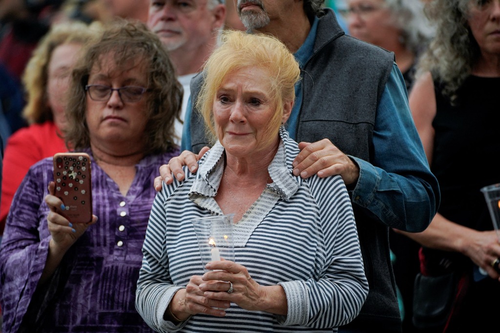 Mourners attend at a vigil in Everts Park after a mass shooting at a Fourth of July parade in the neighboring Chicago suburb of Highland Park, in Highwood Illinois, U.S. July 6, 2022. 