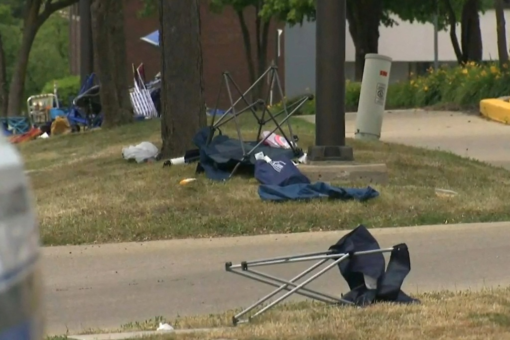 Folding chairs are left after gunfire erupted at a Fourth of July parade