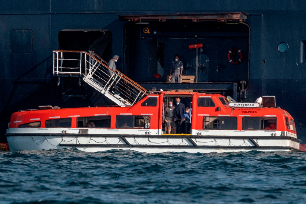 Passengers of Holland America's cruise ship Zaandam are transferred to the Rotterdam cruise ship in Panama City.