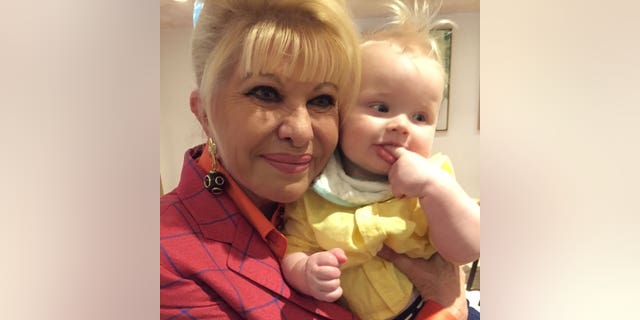 Ivana Trump holding  her grandson.