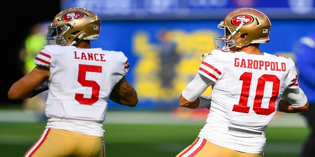 San Francisco 49ers Quarterback Trey Lance (5) and San Francisco 49ers Quarterback Jimmy Garoppolo (10) warm up before the NFL game between the San Francisco 49ers and the Los Angeles Rams on Jan. 9, 2022, at SoFi Stadium in Inglewood, CA