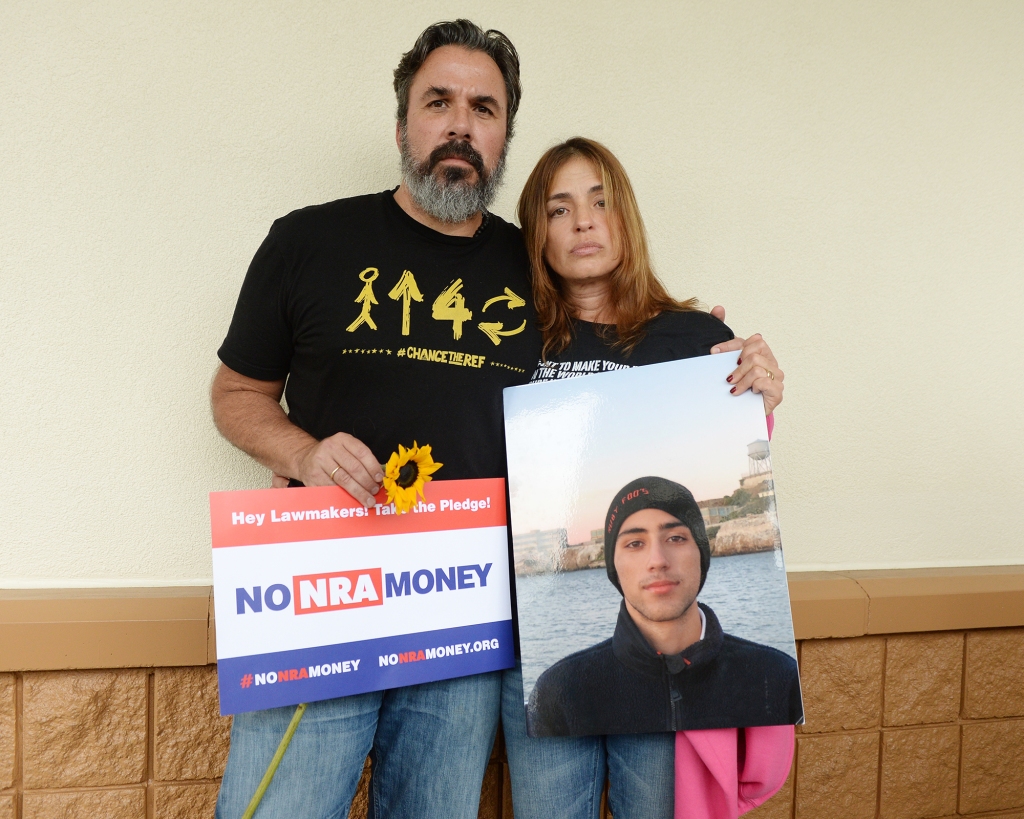 Manuel Oliver and his wife Patricia Oliver pose for a portrait during a 'die'-in' protest in a Publix supermarket. 