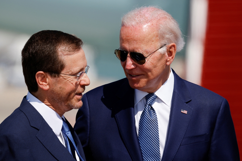 Israeli President Isaac Herzog and U.S. President Joe Biden participate in a welcoming ceremony at Ben Gurion International Airport in Lod, near Tel Aviv, Israel, July 13, 2022.