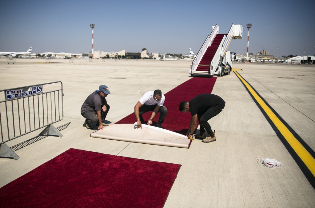 Workers set the red carpet during the final rehearsal for the ceremony welcoming U.S. President Joe Biden a head of his visit to Israel on July 12, 2022 in Lod, Israel