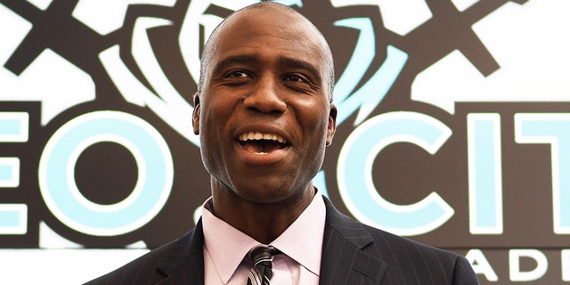 Newly appointed state Surgeon General Dr. Joseph Ladapo speaks during a press conference at Neo City Academy in Kissimmee, Florida.