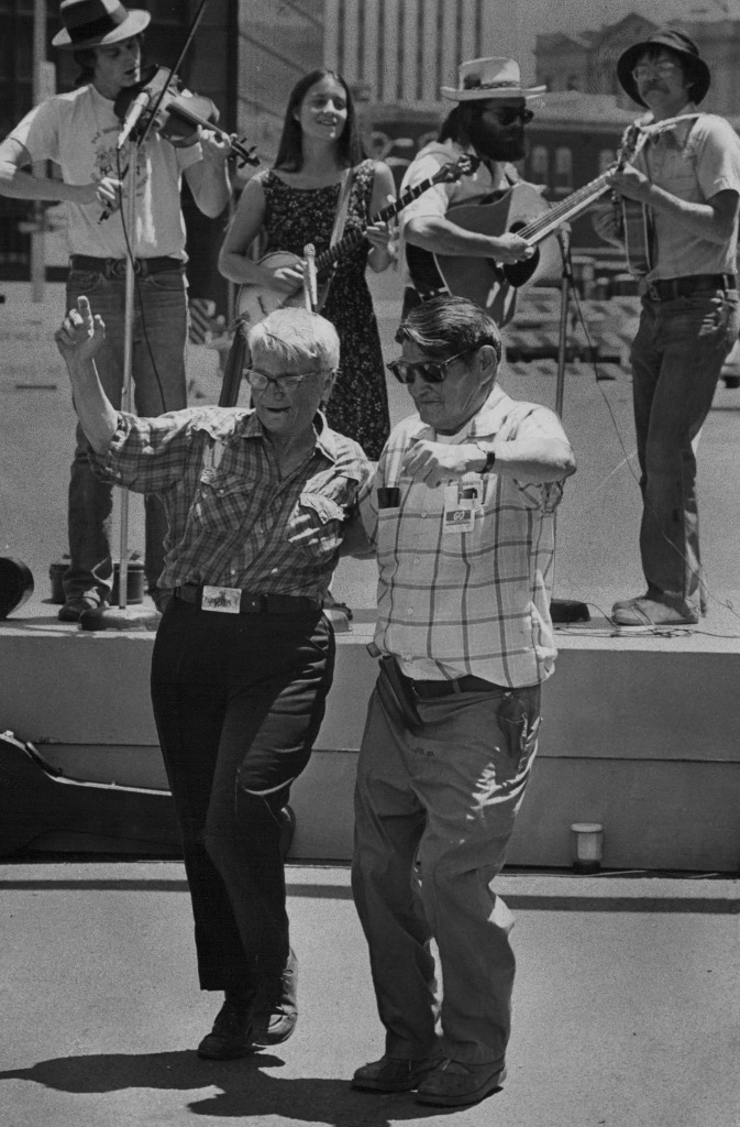 Two men dance during an Independence Day performance, circa 1960. 