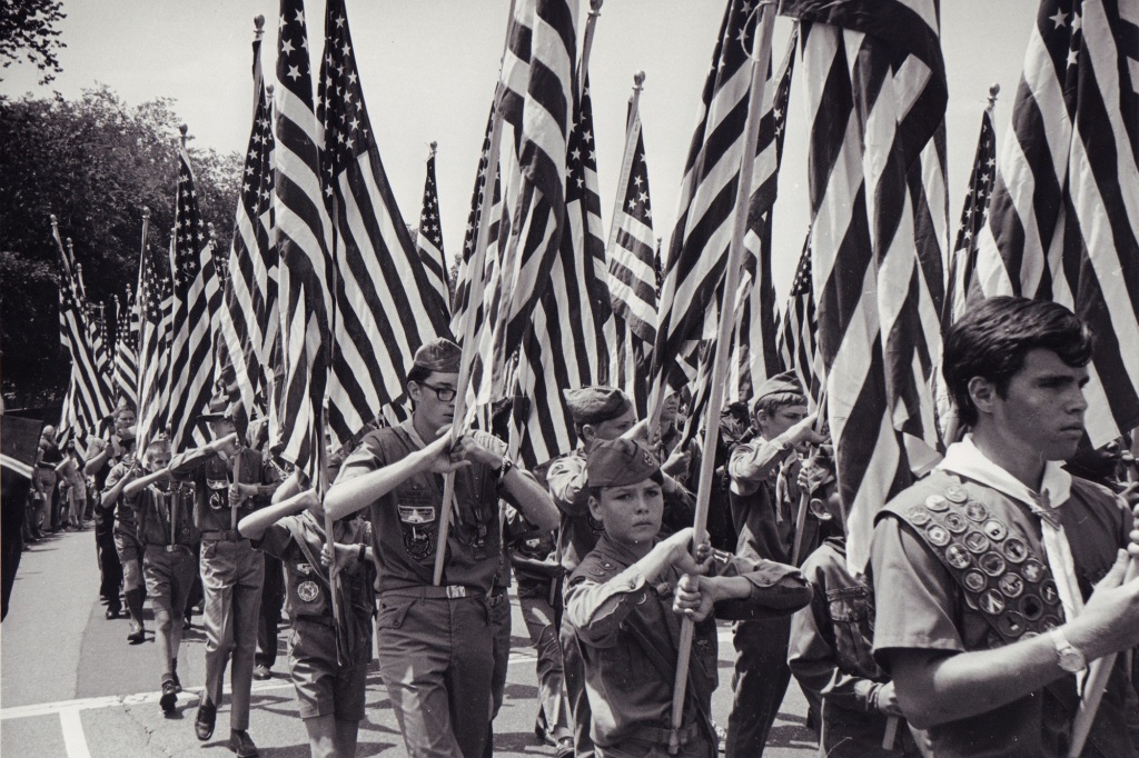 Boy Scouts carry American flags for the Fourth of July (AKA Honor America Day) in Washington, D.C., circa 1970.