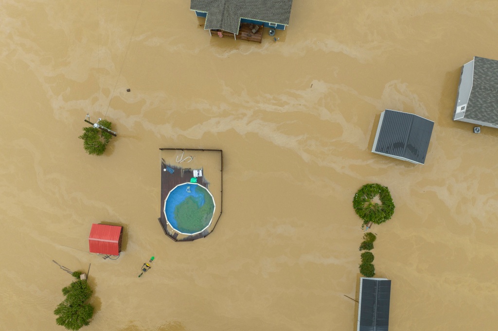 Houses were partially submerged in water after floods ravaged small towns in eastern Kentucky.