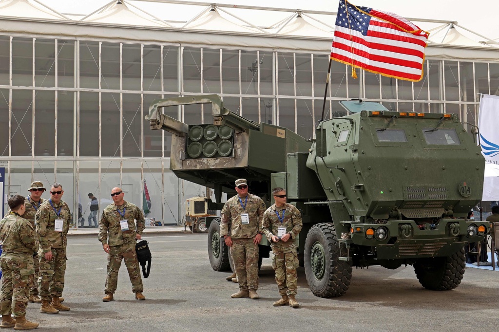taken on March 06, 2022 US military personnel stand by a M142 High Mobility Artillery Rocket System