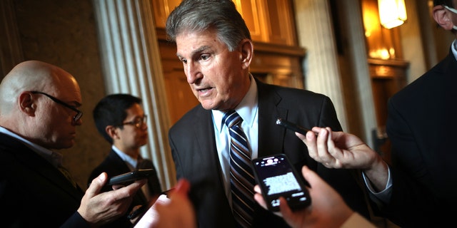 Sen. Joe Manchin, D-W.Va., talks with reporters at the U.S. Capitol, May 28, 2021, in Washington, D.C.