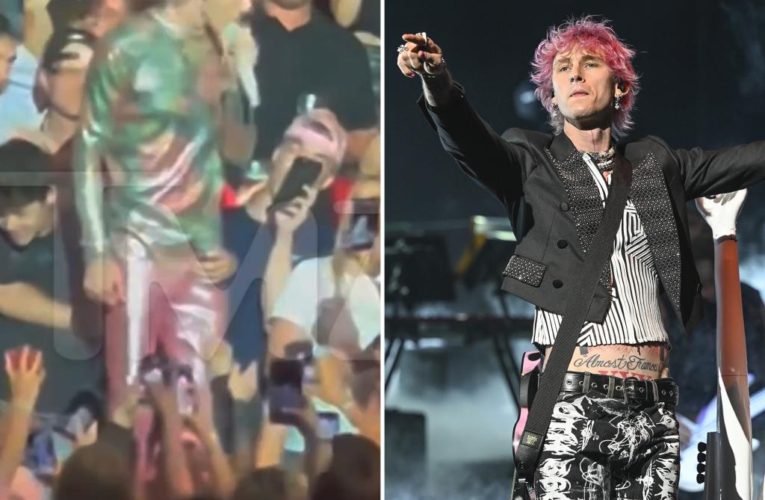 Machine Gun Kelly groped by a fan during his concert