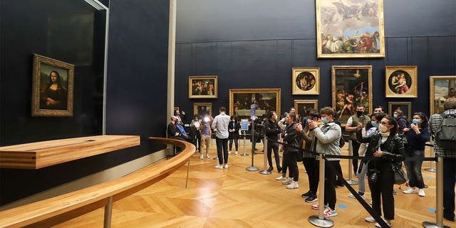 Millions make their way to the Louvre every year to catch a glimpse of the famous painting. 