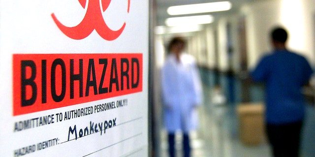 A warning sign on the door of the lab where the first step is taken in the testing of samples for monkeypox at the University of Minnesota's Veterinary Diagnostic Laboratory.