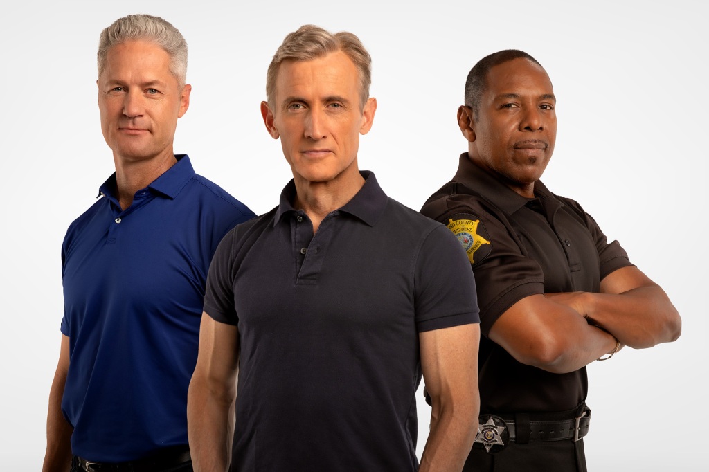 Photo showing "On Patrol: Live" hosts Sean "Sticks" Larkin, Dan Abrams and Deputy Sheriff Curtis Wilson. They're standing side-by-side and looking directly at the camera. Wilson has his arms crossed on his chest and is wearing his uniform.