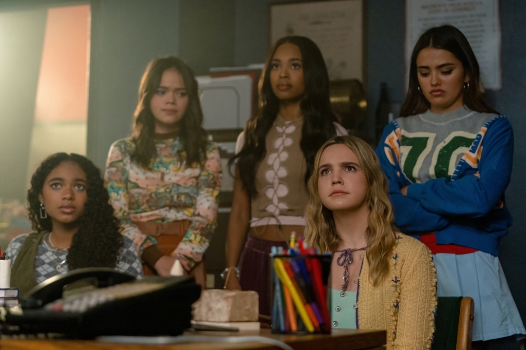 Chandler Kinney, Malia Pyles, Zaria, Bailee Madison, and Maia Reficco sit in a room looking worried about something in "Pretty Little Liars: Original Sin." 