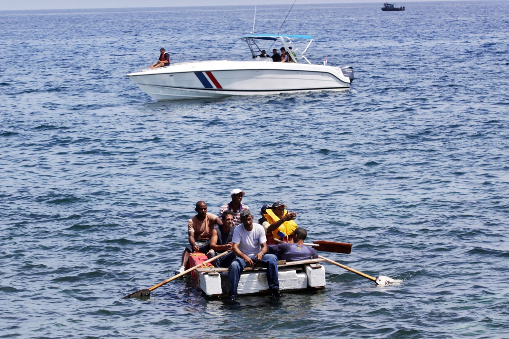 Cuban security officers capture exiles attempting to leave the Malecon waterfront in Havana, Cuba on June 4, 2009.