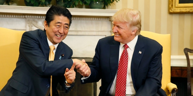 Japanese Prime Minister Shinzo Abe shakes hands with U.S. President Donald Trump during their meeting in the Oval Office at the White House in Washington, Feb. 10, 2017.