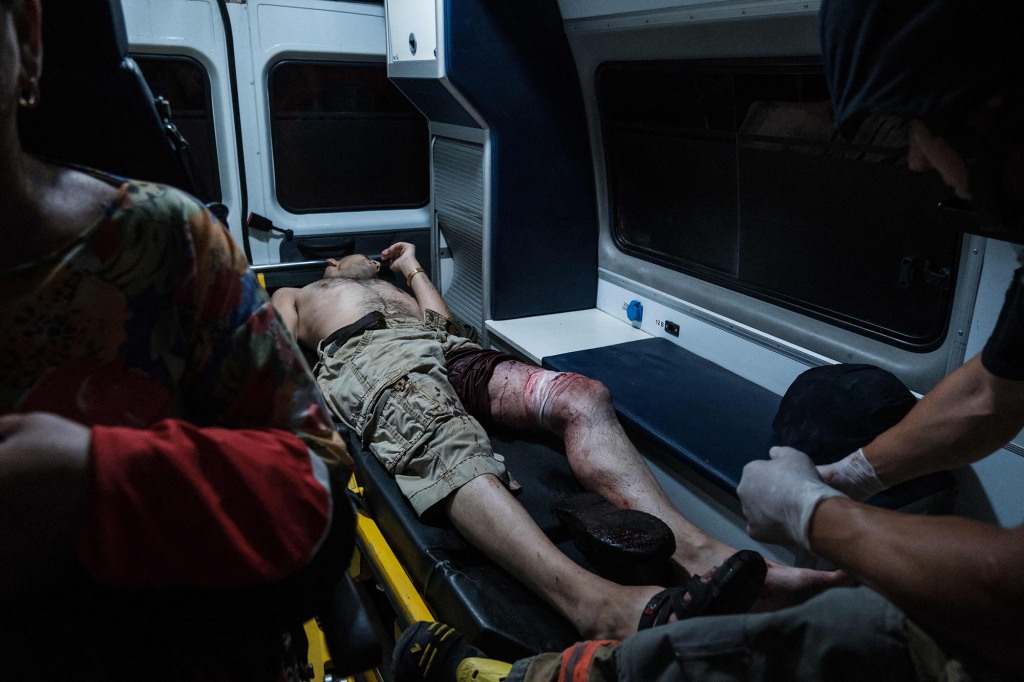 Paramedics carry a wounded man after Russian shelling to an emergency unit in Bakhmut, Donetsk region, July 24.