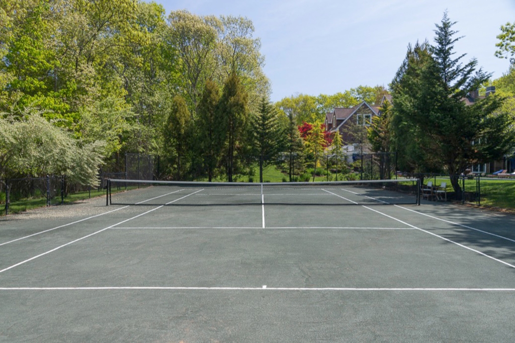 Exterior of the home's tennis court.