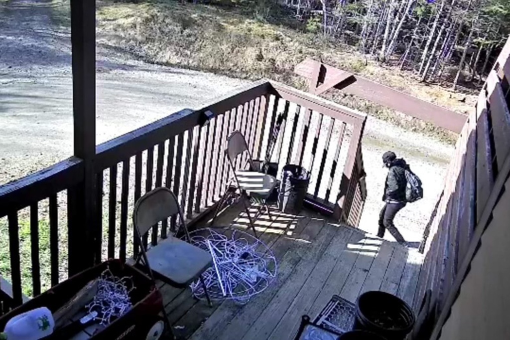 Police in Perry, Maine, released screenshots from a surveillance video showing Brackett walking by Neptune's home. 